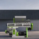 Photo of ruminant cattle feed pellet machine on cement ground, heavy-duty pellet mill to produce high quality cattle feed pellets for livestock farms